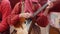 Folk music russian ensemble - woman in Russian folk costume playing the balalaika