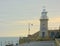 Folkestone Lighthouse from harbour wall. Kent, UK