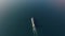 Follow aerial view of the large empty container ship sailing in sea to loading port