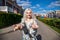 Follow me, Happy young blonde girl in white flowers dress