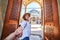 Follow me. A woman tourist in a hat leads her friend to the Turkish mosque Suleymaniye, Istanbul, Turkey. Travel and religion