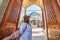 Follow me. A woman tourist in a hat leads her friend to the Turkish mosque Suleymaniye, Istanbul, Turkey. Travel and religion