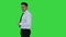 Follow me Young businessman walks in frame and invites you to follow him on a Green Screen, Chroma Key.