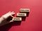 Follow these steps symbol. Wooden blocks with words Follow these steps. Beautiful red background. Businessman hand. Business and