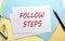 FOLLOW STEPS text on paper on the colorful paper background