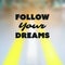 Follow Your Dreams - Inspirational Quote, Slogan, Saying - Success Concept Illustration with Label and Blurry Highway Image