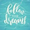 Follow your dreams lettering on turquoise. Vector