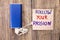 Follow your Passion is shown on a note paper in various colors. The power device of blue color with white cable on wooden backgrou