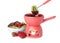 Fondue pot with chocolate, berries and fruits isolated