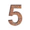 Font on brick texture. Digit five, 5, cut out of paper on a background of real brick wall. Volumetric white fonts set