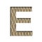 Font on a embossed metal sheet. The letter E is cut out of white paper on the background of a weathered sheet of metal with a