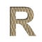 Font on a embossed metal sheet. The letter R is cut out of white paper on the background of a weathered sheet of metal with a