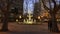 Font at a Square framed by trees on the evening