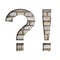 Font on white brick. Exclamation and question marks cut from white paper the background of a sloppy white brick wall. Popular