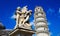 Fontana dei Putti and Leaning Tower of Pisa in Piazza dei Miracoli Square of Miracles in Pisa, Tuscany