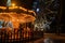 Fonte Nova`s garden with Christmas market and colored ferris wheel near Ria de Aveiro at night