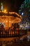 Fonte Nova`s garden with Christmas market and colored ferris wheel near Ria de Aveiro at night