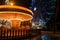 Fonte Nova`s garden with Christmas market and colored ferris wheel near Ria de Aveiro at night