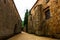 Fontfroide Abbey monastery in France. Empty alley with brick walls