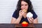 Food addiction, dieting concept. Young overweight woman fed up w