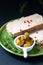 Food appertiser Concept French meatloaf Terrine or pate  in green dish with copy space