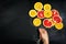 Food Art. Fruit slices on a dark Chalkboard Background with strings. Balloons from fruit slices. Healthy life, detox concept.