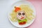 Food art. Funny design of meal. For Kids. Lunch background. Spagetti and vegetables. Creative idea.