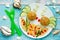 Food art idea healthy lunch for kids meatballs with bulgur porridge and fresh vegetables shaped cute fishes