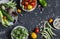 Food background. Assortment of fresh vegetables on a dark background. Top view