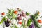 Food background. Assortment of fresh vegetables on a light background - zucchini, eggplant, peppers, beets, tomatoes, green