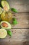 Food background with avocado, lime, olive oil and basil on old w