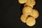 Food background black with small round biscuit. Top view on round cookies with sesame