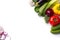 Food background border frame of colorful fresh produce raw vegetables, cucumber purple cabbage spinach tomatoes paprika onion