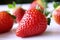 Food background .Closeup on a freshly organic red ripe strawberries lying on a white background.Summer ripe berries.Delicious frui