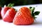 Food background .Closeup on a freshly organic red ripe strawberries lying on a white background.Summer ripe berries.Delicious frui