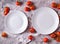 Food background with empty plate, tomatoes and kitchen towel