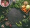 Food background frame with ingredients for tasty Ham Hock Soup : raw beef meat shin with bone, root vegetables, herbs and spices