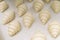 Food background. Fresh homemade croissants. Close up shot of Uncooked traditional french pastry. Ready to cook croissant