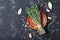 Food background of herb thyme and spices on black kitchen table top view.