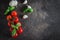 Food Background. Organic Cherry Tomatoes, basil, garlic on stone background. Top view, copy space