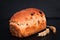 Food background Organic French whole wheat Raisin bread on black background plate