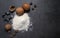 Food background with a place for text. eggs, flour, nuts, whisk and baking forms. view from above