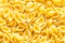Food background from uncooked conchiglie pasta