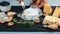 Food banner, cheese with blue mildew, Camembert or brie cheese circle, gouda on wooden background. Flat top view from above. copy