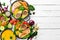 Food banner: pasta, chicken, pumpkin, salad, meat, mushrooms. On a white wooden background.