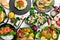 Food banner: pasta, chicken, pumpkin, salad, meat, mushrooms. On a white wooden background. Top view.