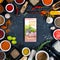 Food blog concept. Indian spices, herbs and smartphone on black