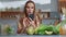 Food blogger taking photo on mobile phone of vegetables on kitchen