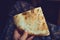 Food of the Caucasian Georgian kitchen,, a girl holds pieces in hands. Piece of pita bread in hand