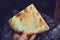 Food of the Caucasian Georgian kitchen,, a girl holds pieces in hands. Piece of pita bread in hand